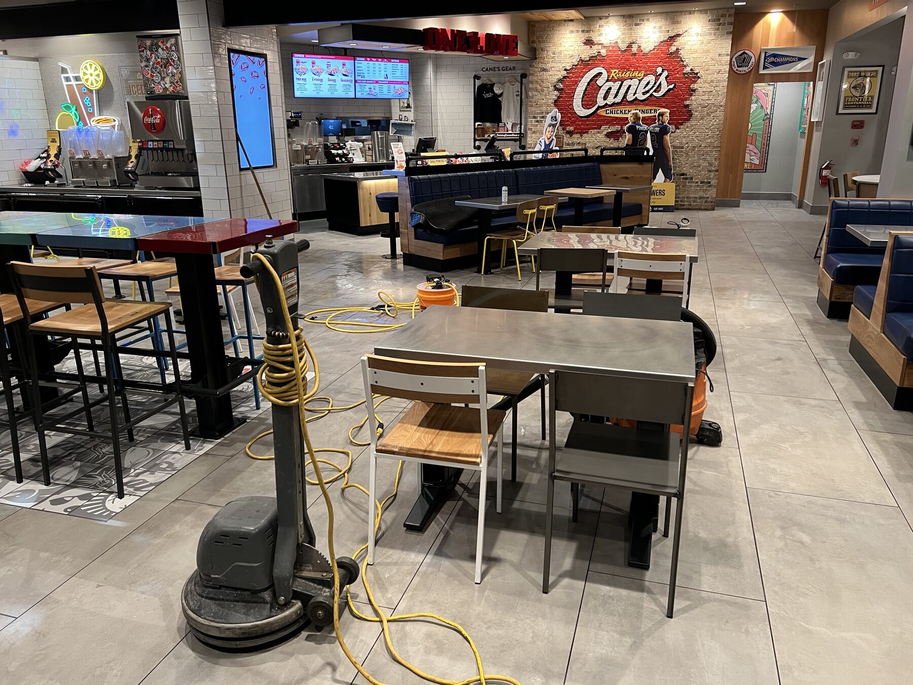 Commercial floor buffer in a Raising Cane's dining room